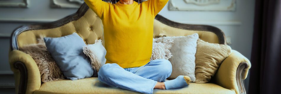 AI-generated background photography featuring a real model in a yellow sweater sitting on an AI-generated vintage sofa. The image was created using a Sony A7R V, Godox strobe lighting, and Luminar Neo for seamless background integration.